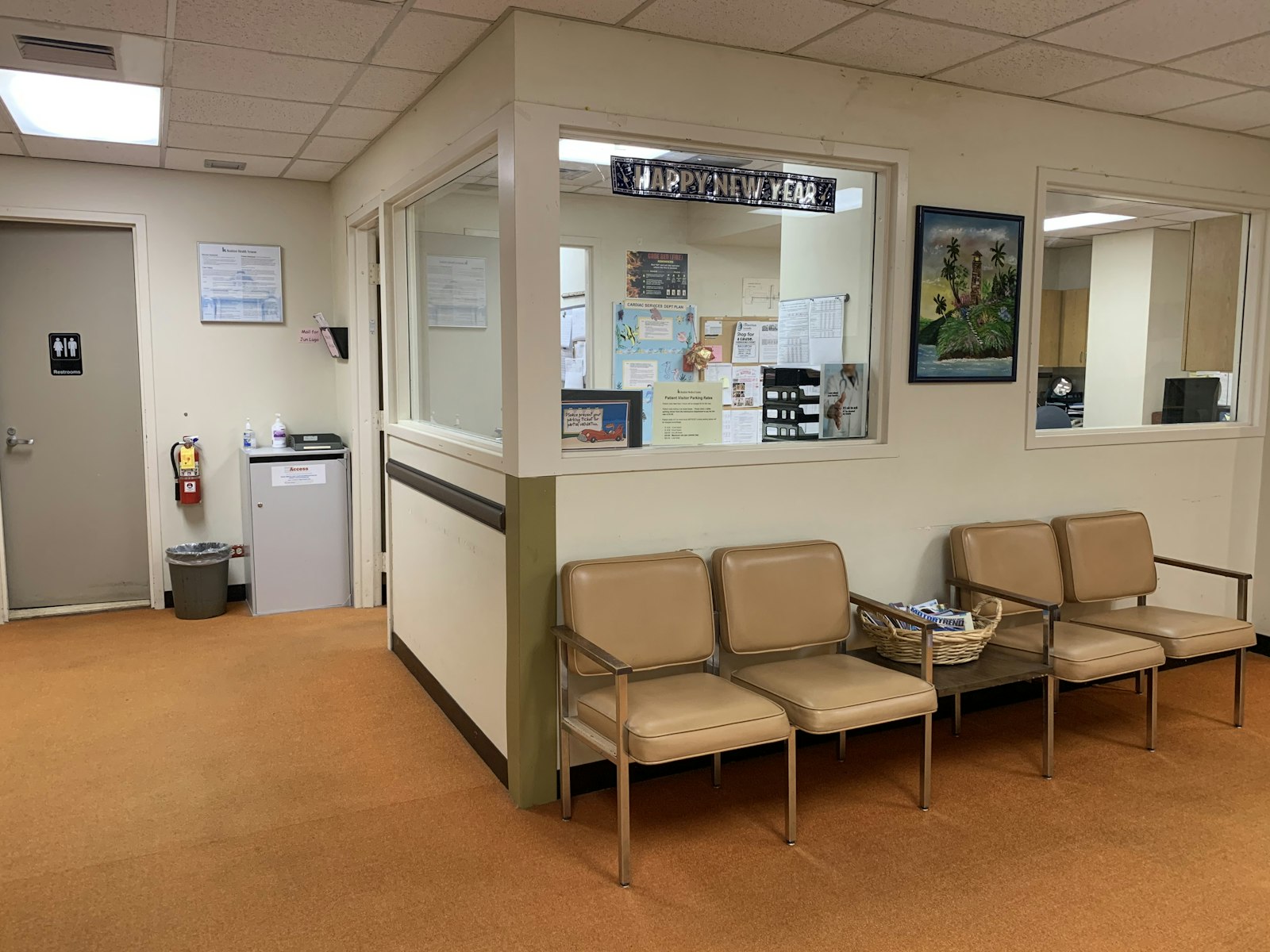 A warm, wood-panelled clinic waiting room with armchairs